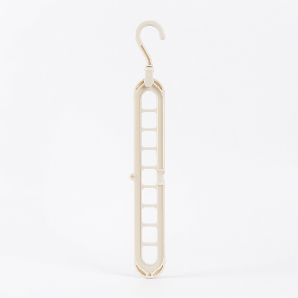 Our signature 9-hook space hanger in a clean white cream. Holds up to 9 garments in the space of one, with a 360° rotating head for any closet configuration.